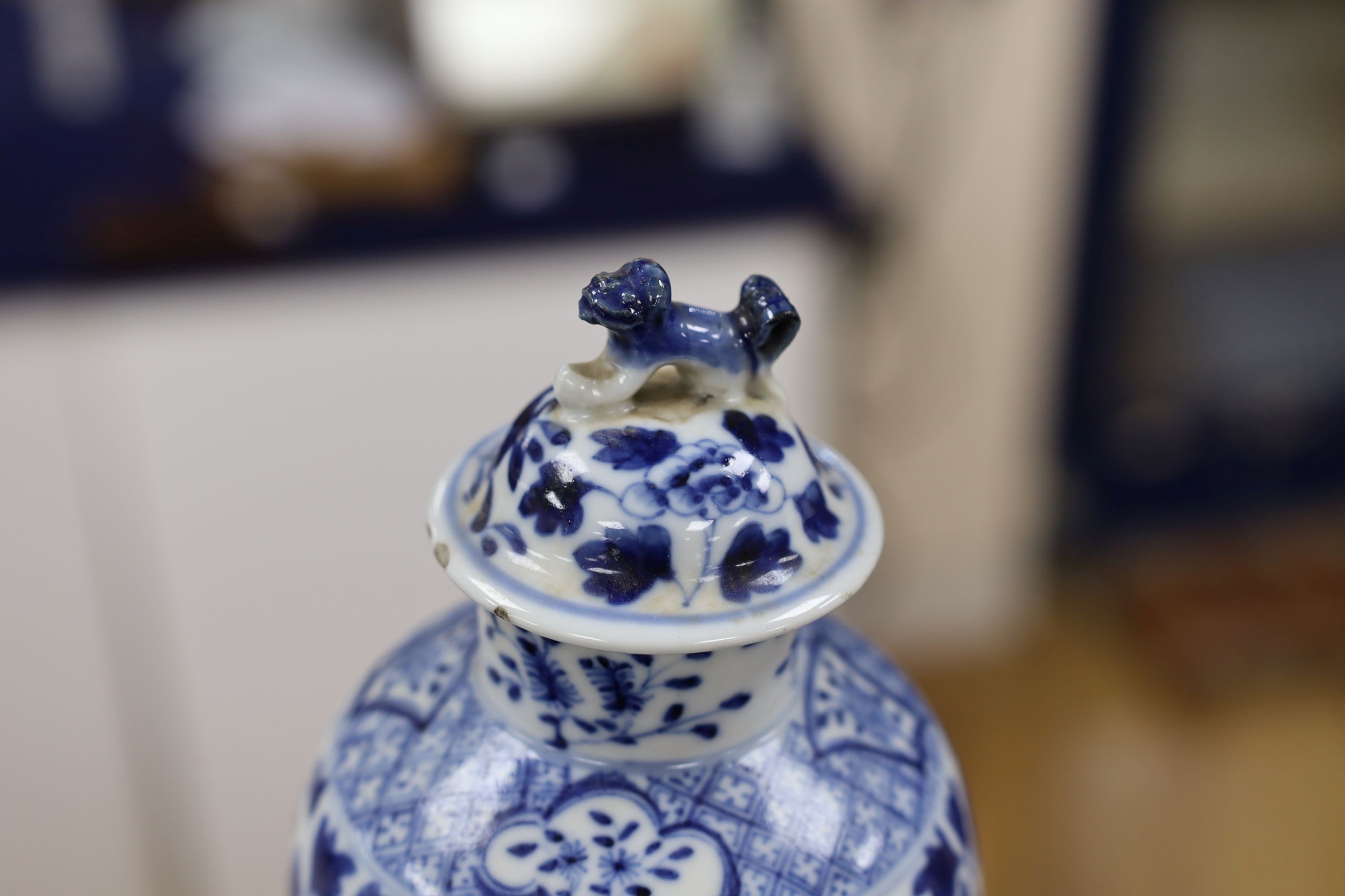 A pair of Chinese blue and white dragon vases and covers, circa 1900. 28cm